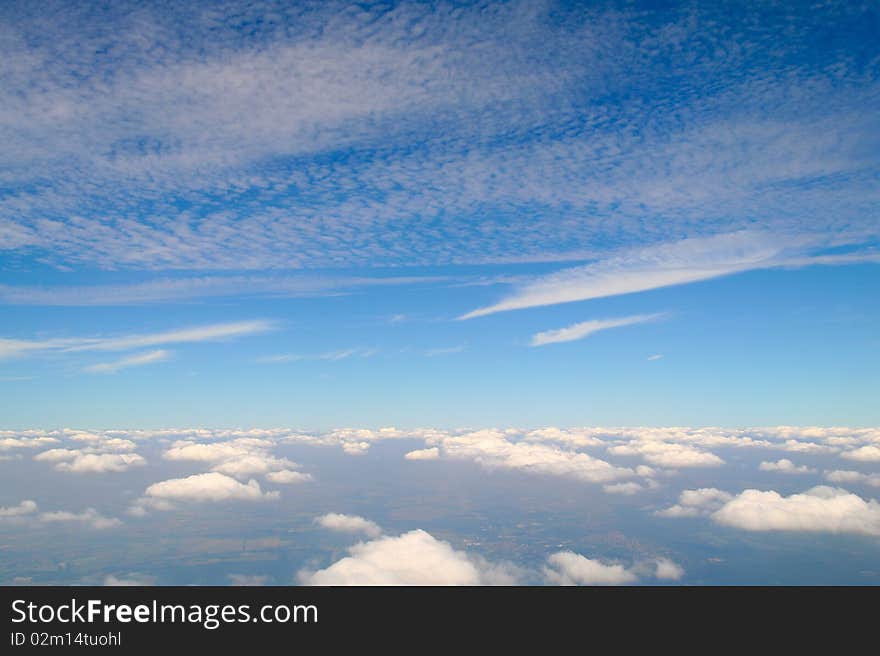 Between the layers of clouds.