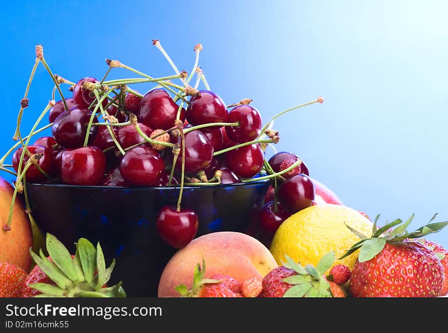 Summer fruits on plate close-up. Summer fruits on plate close-up