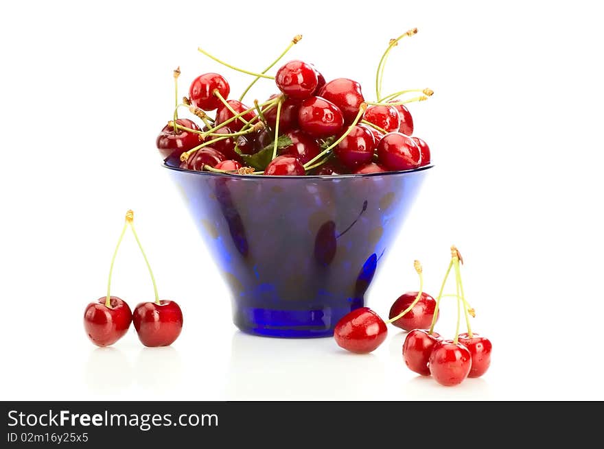 Lot of cherries in the blue bowl. Lot of cherries in the blue bowl