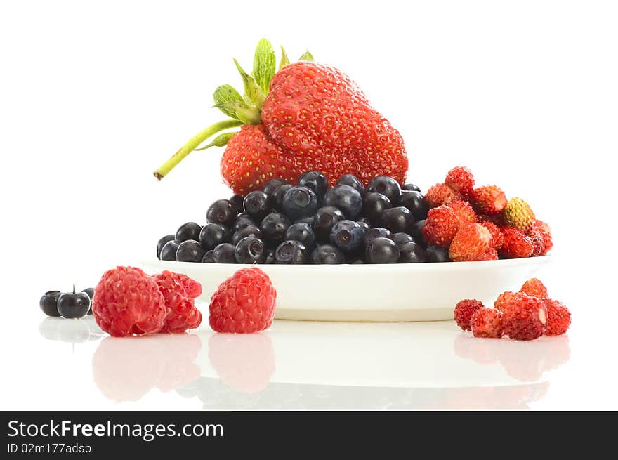 Summer fruits on plate close-up with greate strawberry. Summer fruits on plate close-up with greate strawberry