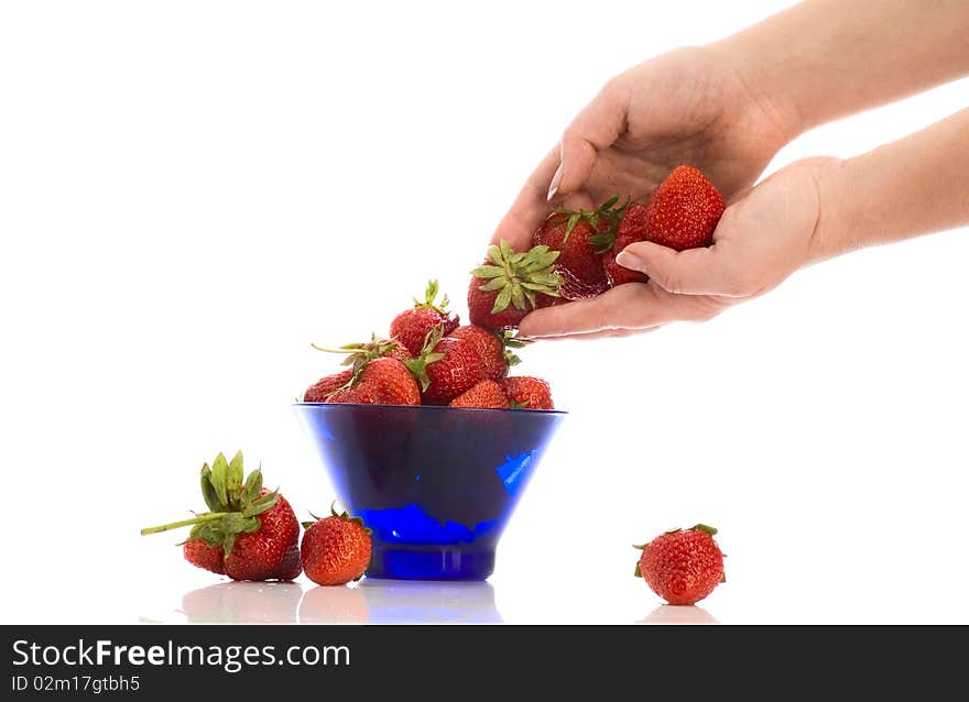 Puting strawberry two the plate. Puting strawberry two the plate