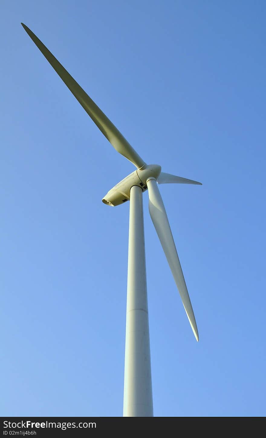 Wind turbines under the summer blue sky