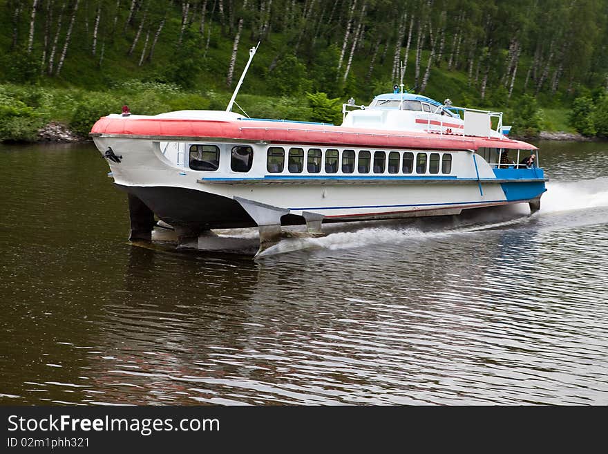 Motor ship on underwater wings floats on the river. Motor ship on underwater wings floats on the river