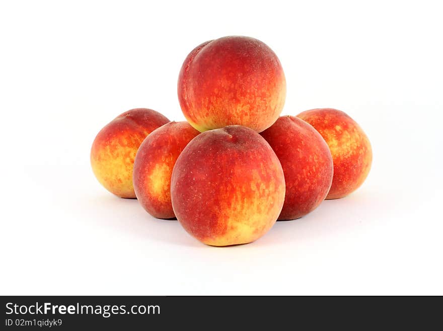 Fresh colorful ripe peaches isolated on white