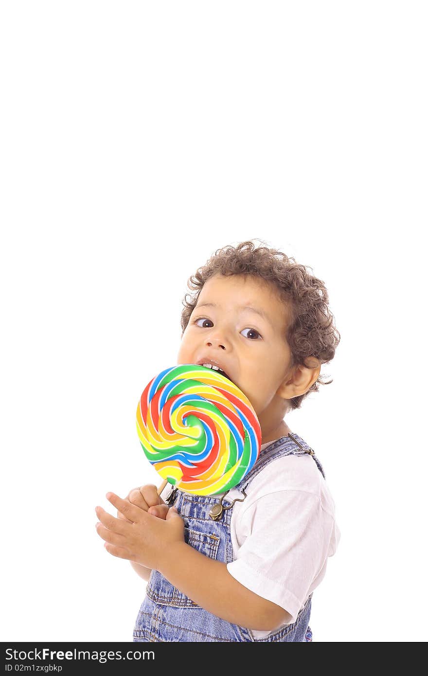 Child eating a big lollipop