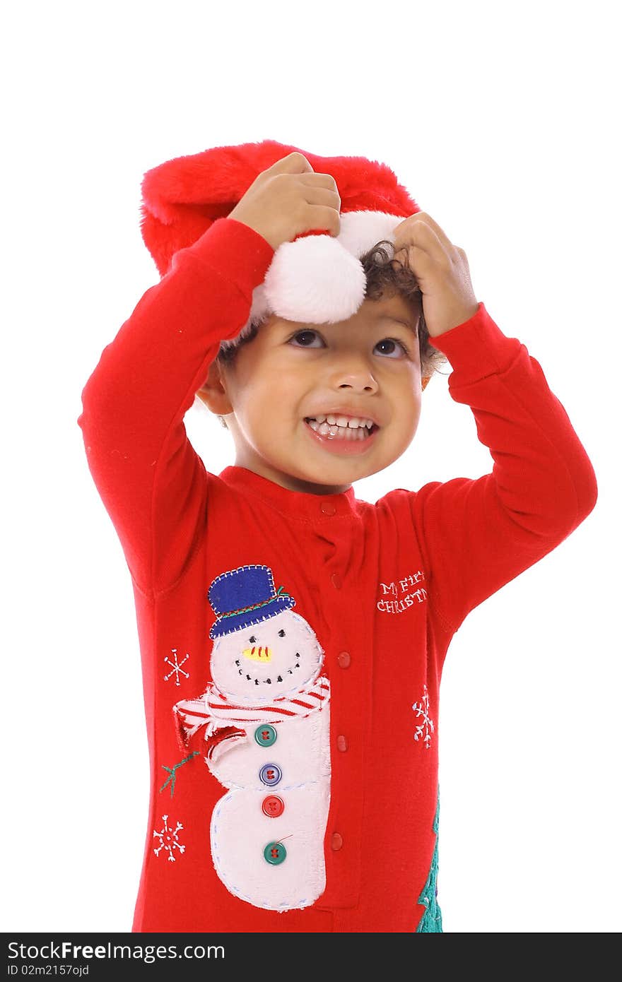 Shot of a toddler fixing santa hat