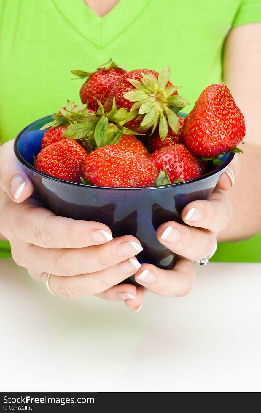 Full plate strawberry in hands