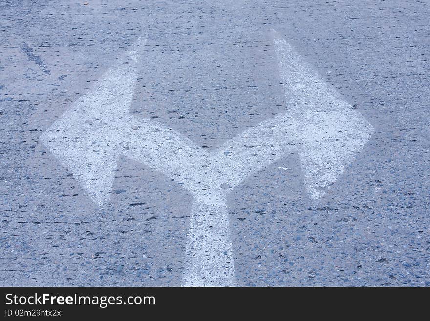 Arrow to cross on the street,sign to the street. Arrow to cross on the street,sign to the street