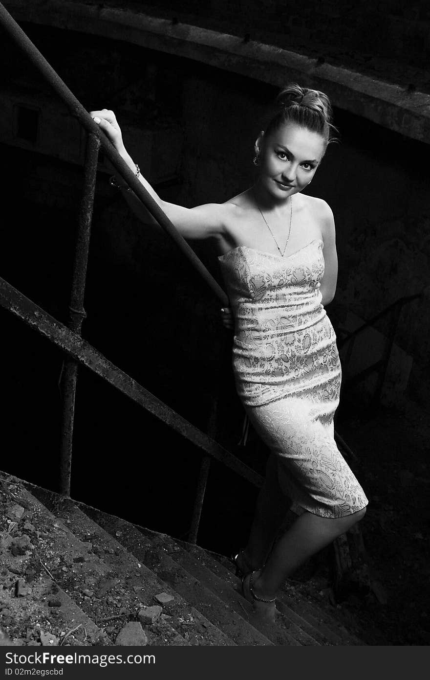 Beautiful young woman posing in the ruins