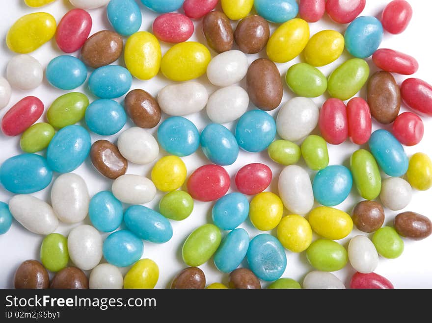 Lots of sweets in different colours on white background. Lots of sweets in different colours on white background