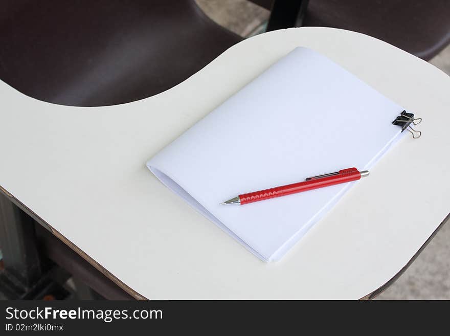 Blank note and the pencil on the desk. Blank note and the pencil on the desk