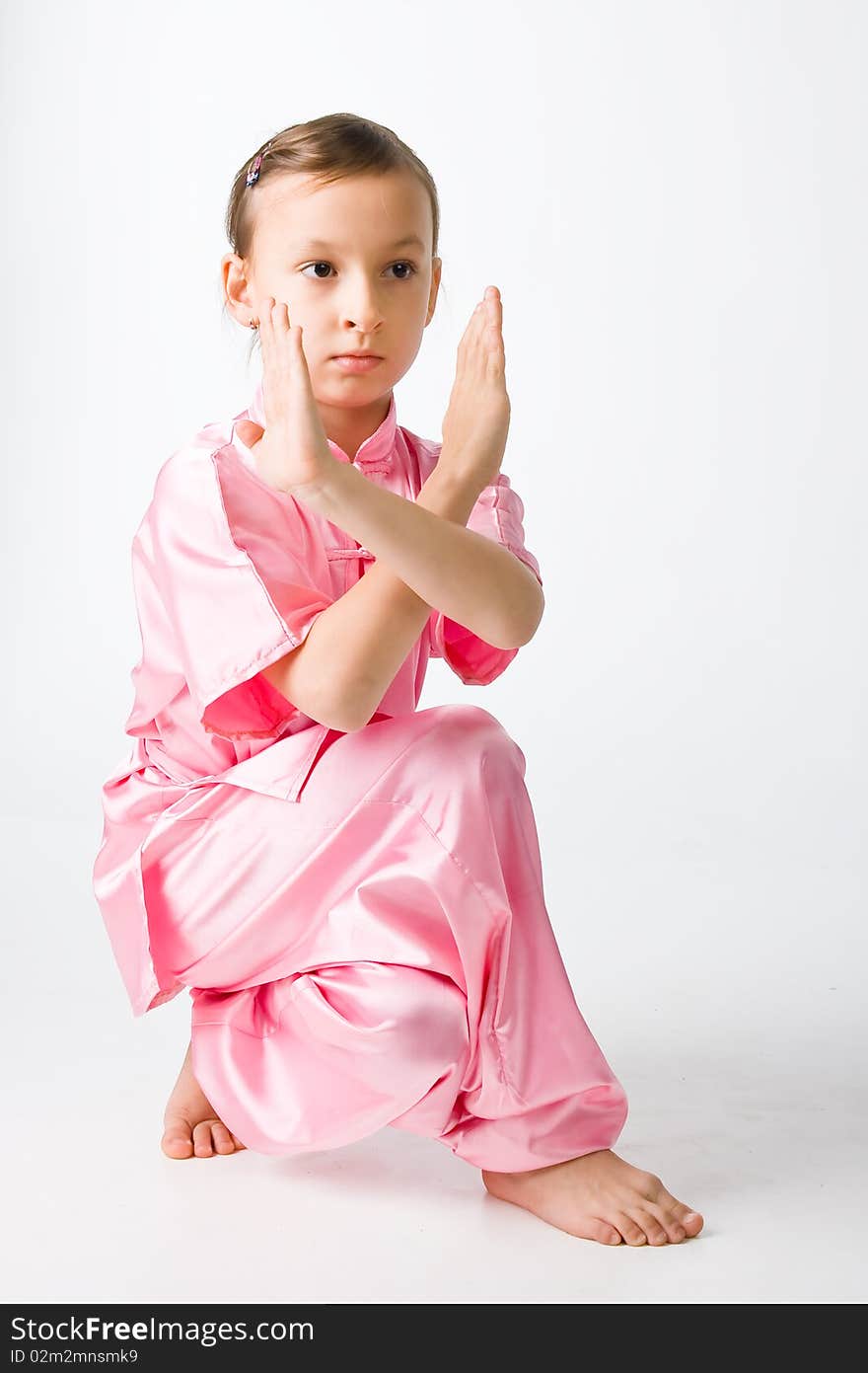 Girl in a pink kimono engaged wushu