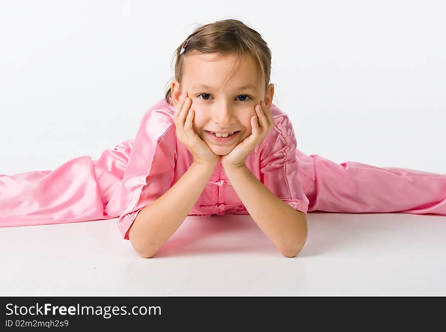 Girl in a pink kimono lies on the floor