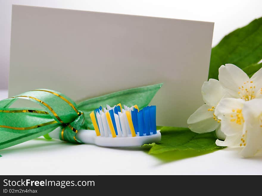 Toothbrush  as gift with tied up ribbon and label. Toothbrush  as gift with tied up ribbon and label