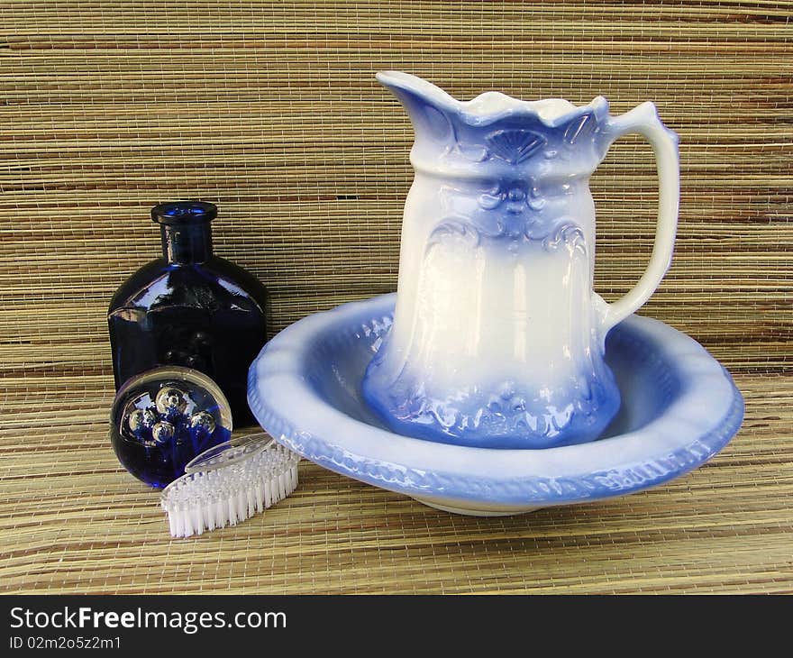 Pitcher and bowl set with bottle, glass,sphere and nail brush