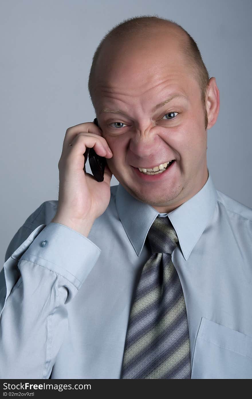 The businessman emotional talking by phone. The businessman emotional talking by phone