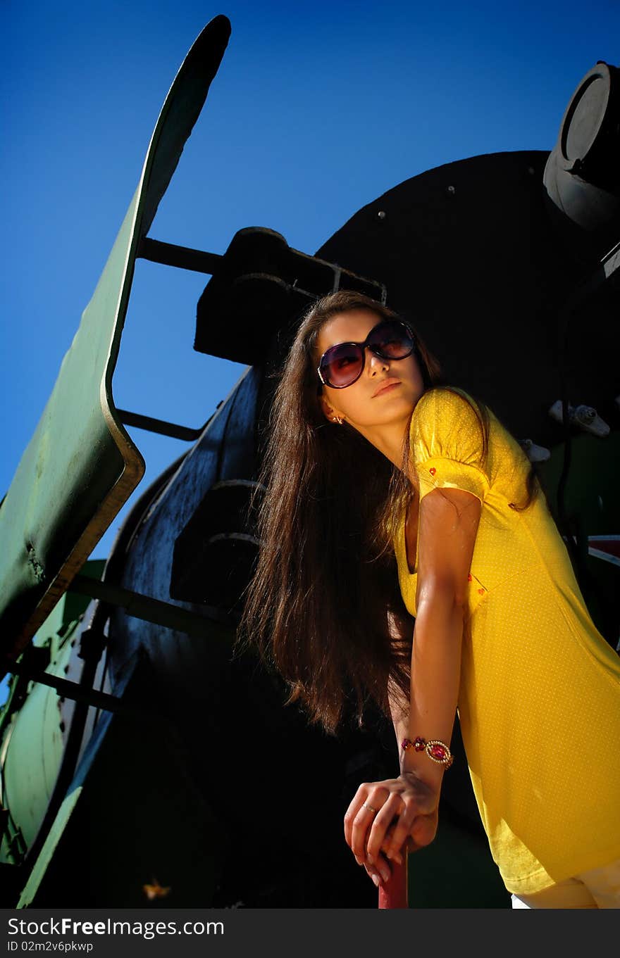 Beautiful girl with train on background.