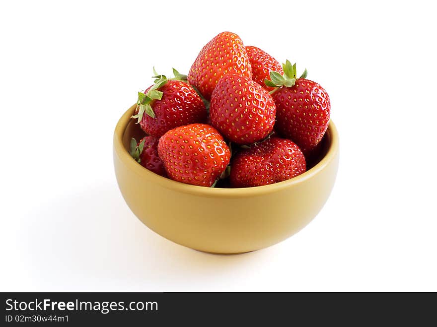 Strawberry is on the yellow plate