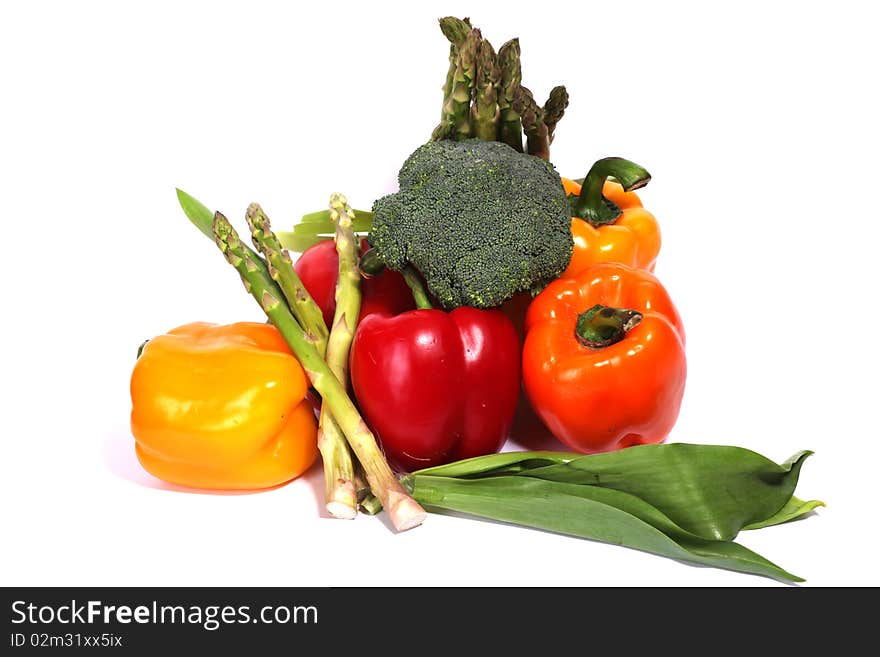 Heap of fresh ripe vegetables isolated at white background