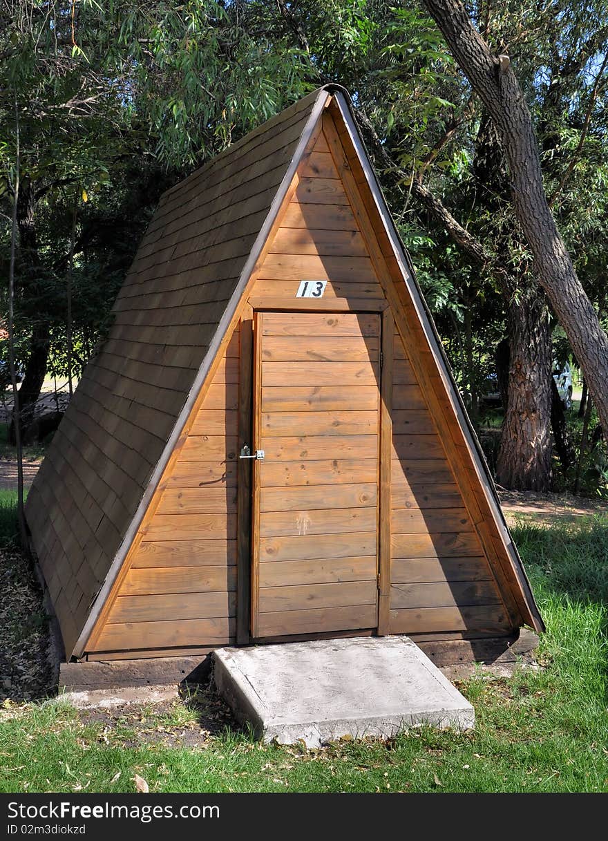 Log cabin for camping on a forest