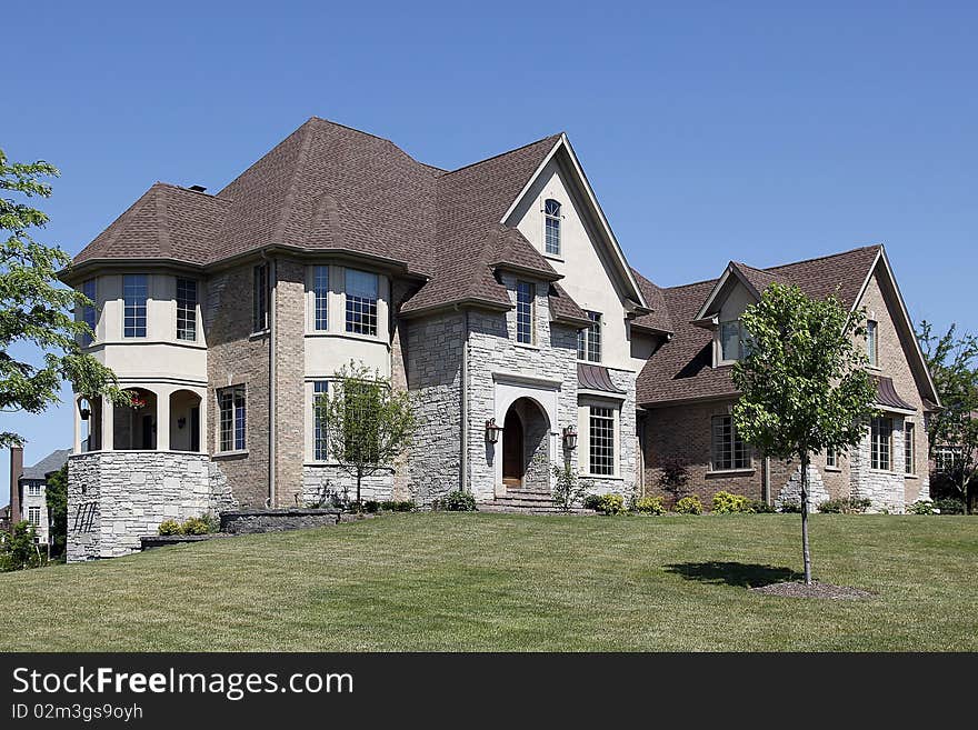 Large home in suburbs with arched entry. Large home in suburbs with arched entry