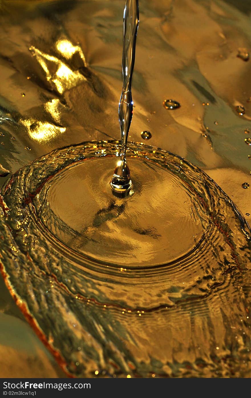 Background of water dripping on gold paper. Background of water dripping on gold paper