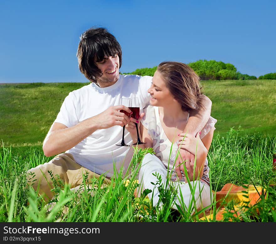 Beautiful girl and boy with wineglasses