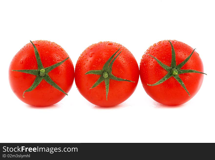 Three red tomato isolated on white background