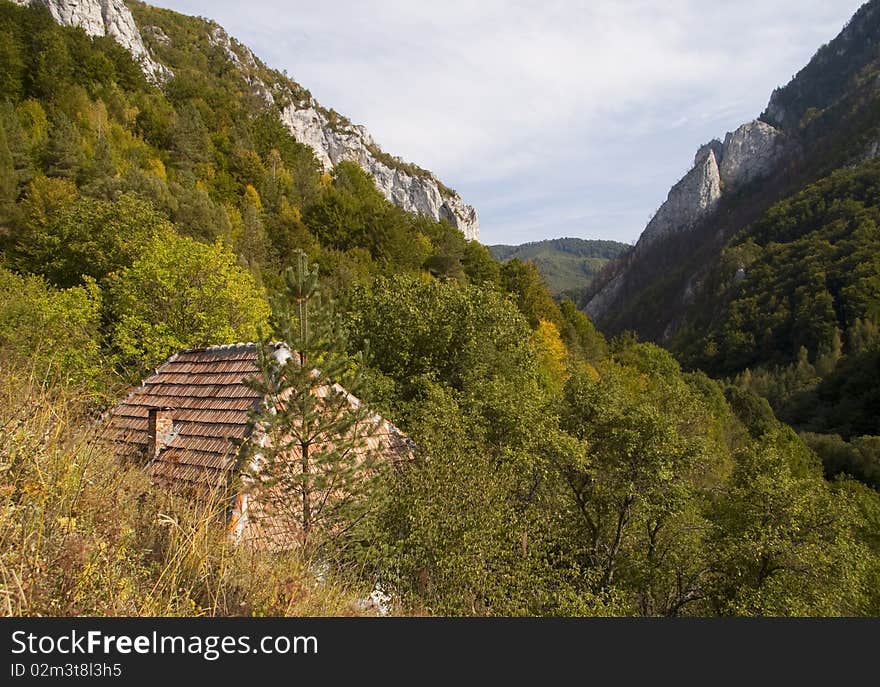 Limestone rocks and valley lonely house