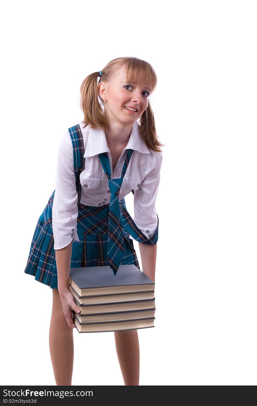 Schoolgirl is holding the stack of book.