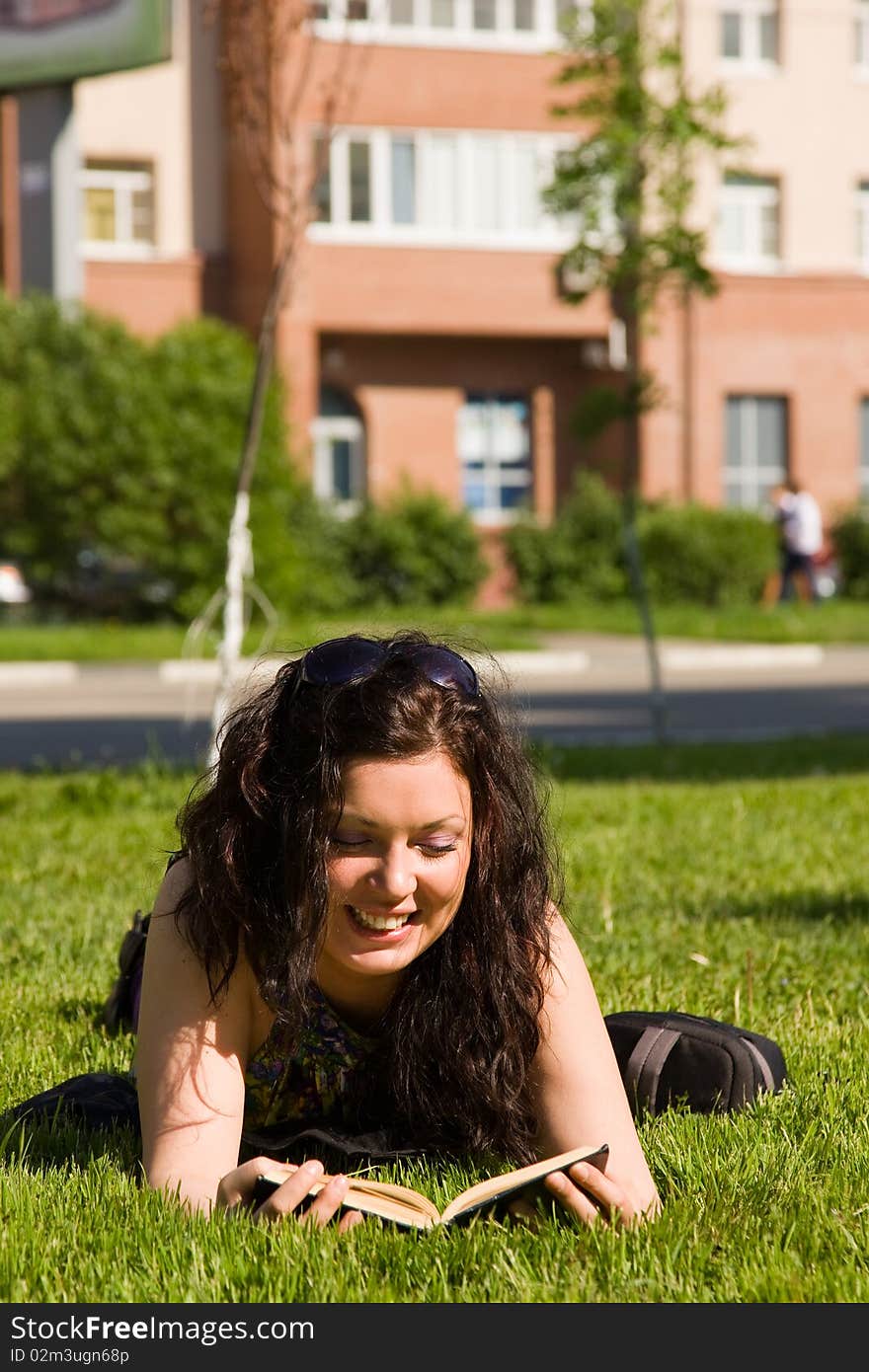 Young Woman Reading A Book.