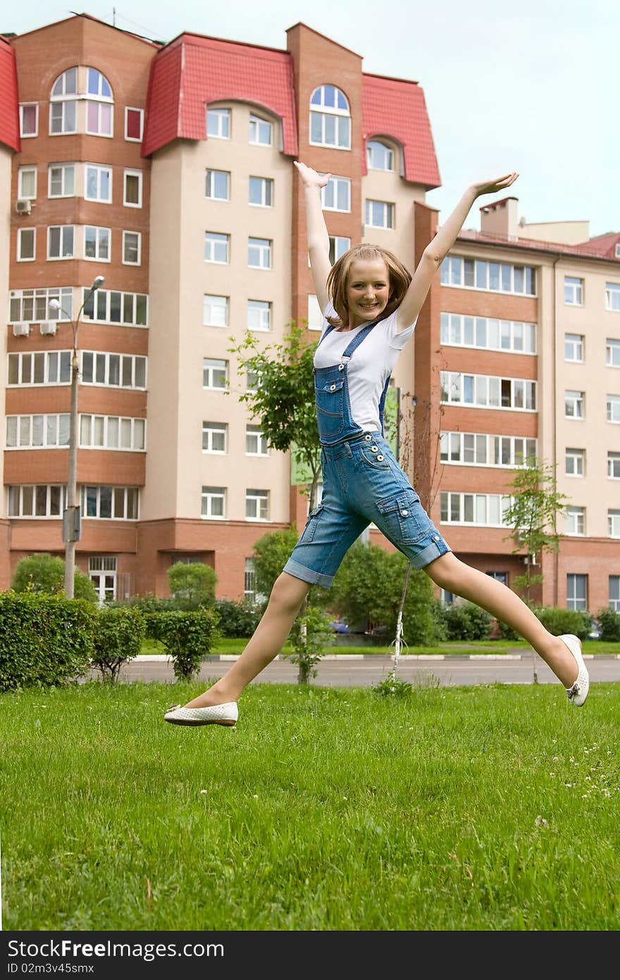 Young happy teenager is jumping outside. Young happy teenager is jumping outside.