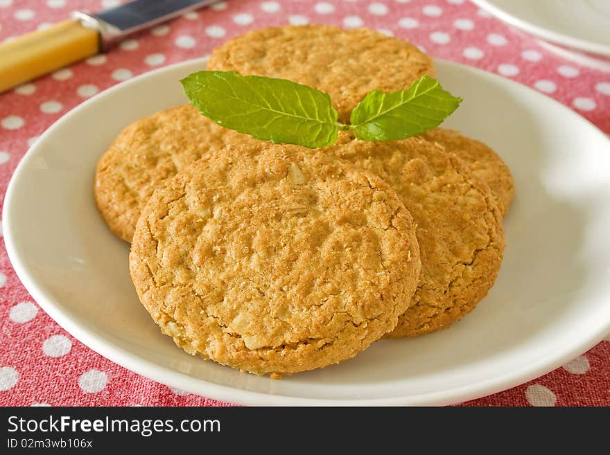 Brown wholemeal biscuits on a white plate