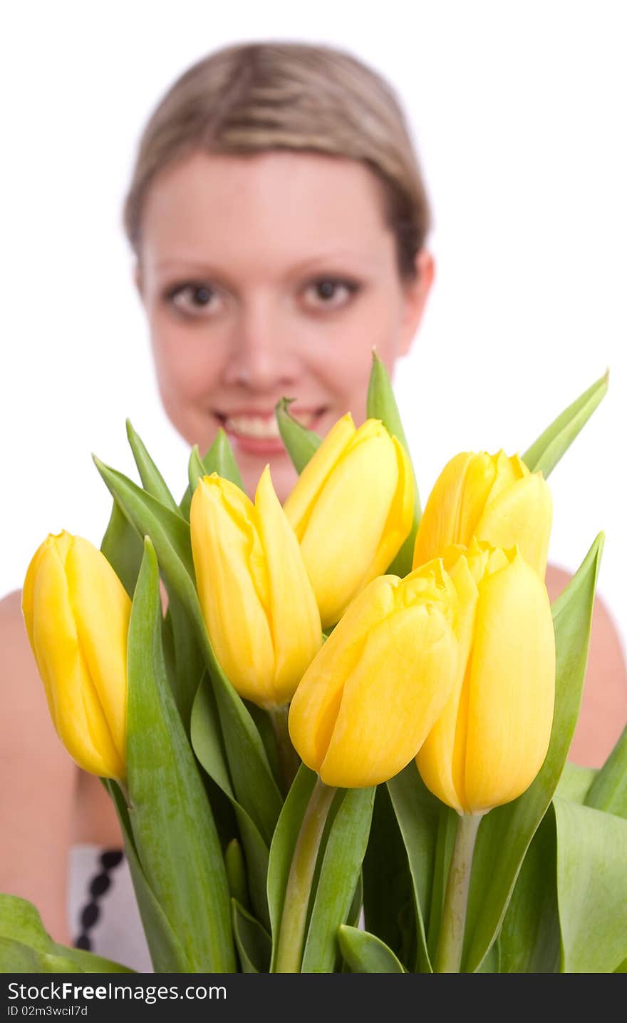 Woman with flowers.  Picture of happy blond with and yellow tulips.  Spring beauty. Pretty young female holding bouquet of tulips isolated on white background . Woman with flowers.  Picture of happy blond with and yellow tulips.  Spring beauty. Pretty young female holding bouquet of tulips isolated on white background .