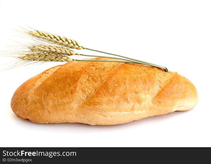 Bread with wheat cones on a white background