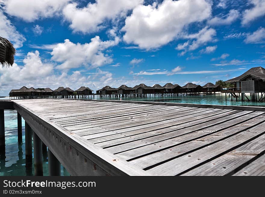 An overwater pathway located at luxury resort, Maldives