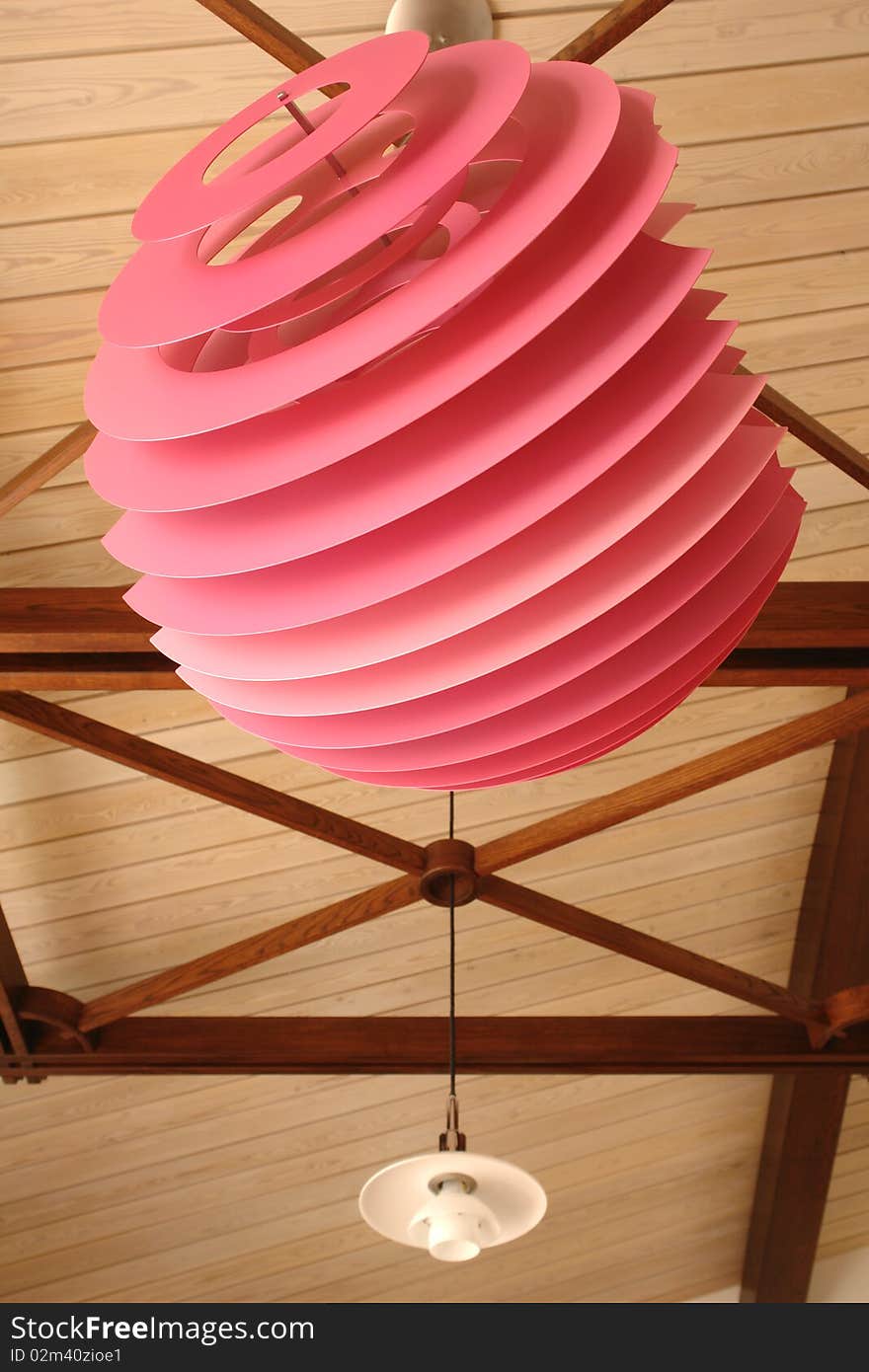 Pink modern lamp on the ceiling