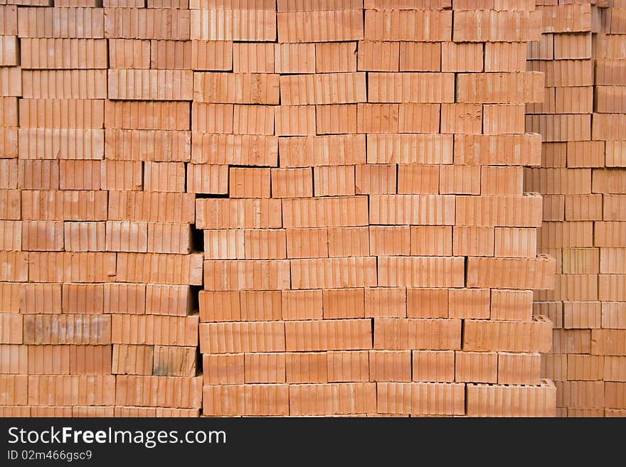 Wall of red bricks material texture background picture