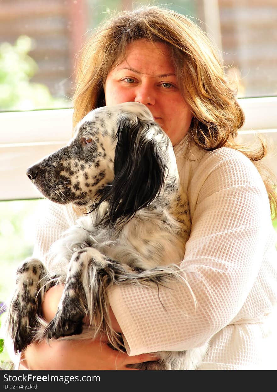 Happy woman with english setter sitting on the porch. Happy woman with english setter sitting on the porch