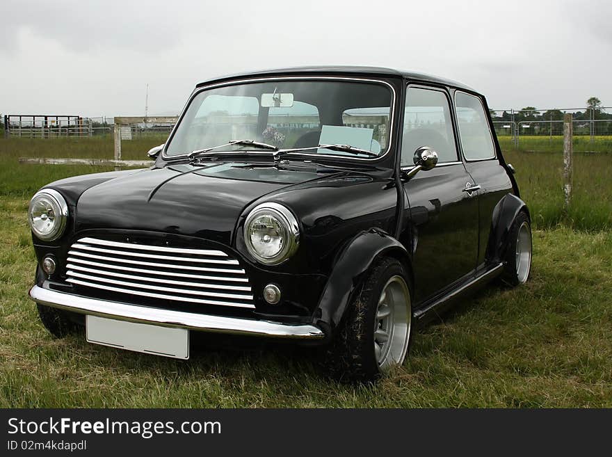 Classic black British car on the grass. Classic black British car on the grass