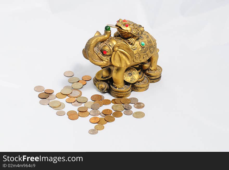 Ancient figurine bronze elephant with frog isolated on coins . Ancient figurine bronze elephant with frog isolated on coins .