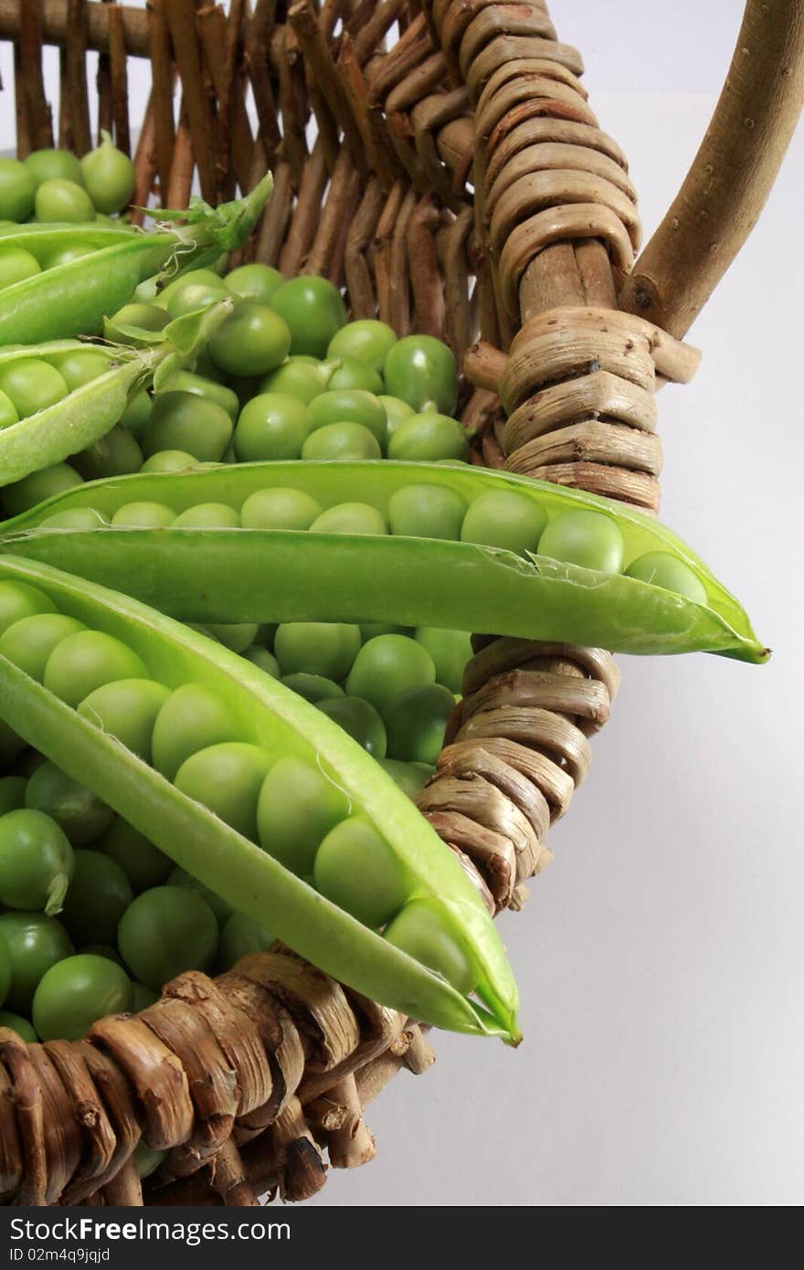 Basket of peas in spring