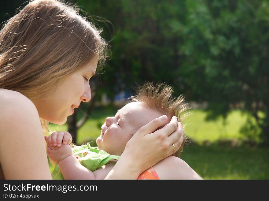 Loving mother and baby outdoors