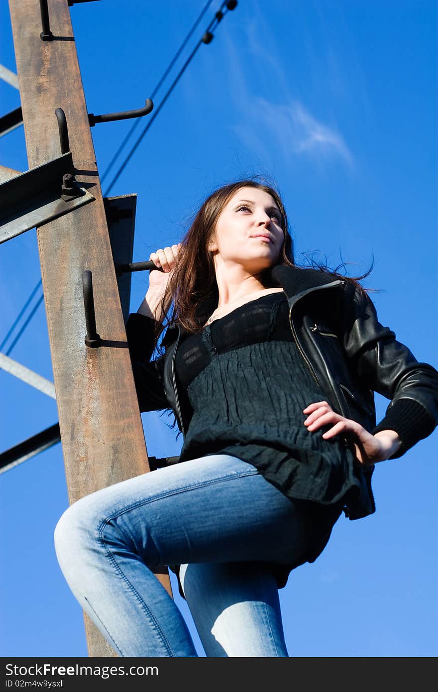 Woman on electrical tower