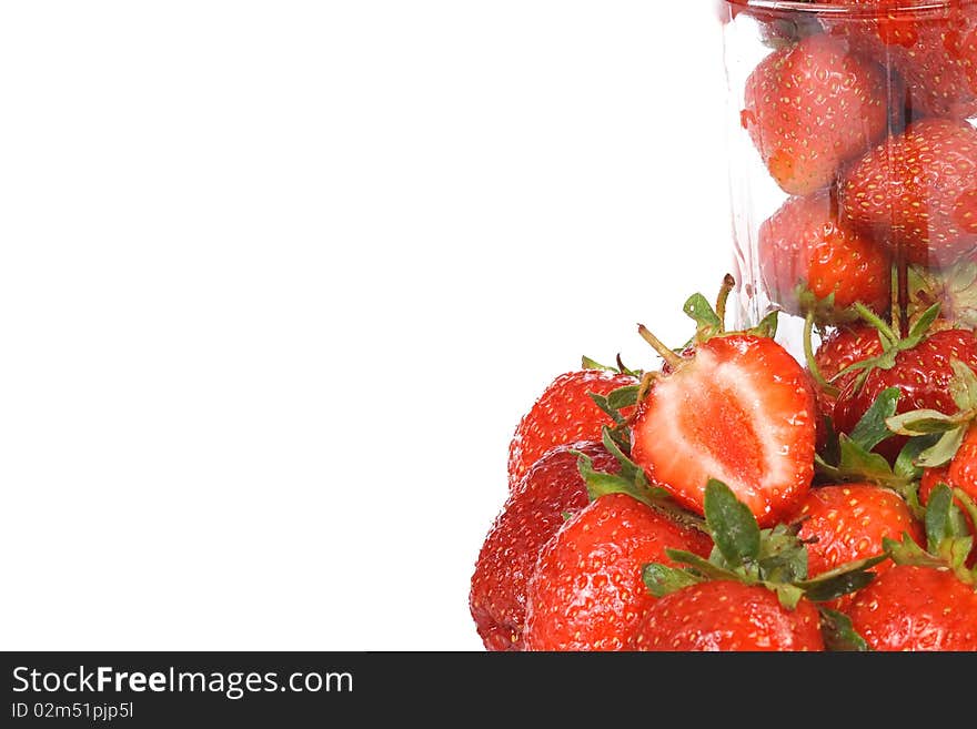 Glass with strawberry on white background