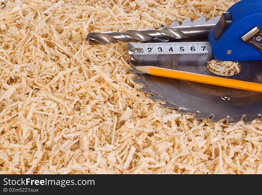 Tape measure and wooden sawdusts. Tape measure and wooden sawdusts