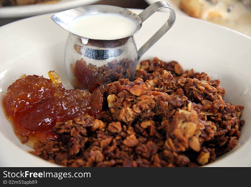 Bowl of Granola (Muesli) milk and honey . Bowl of Granola (Muesli) milk and honey