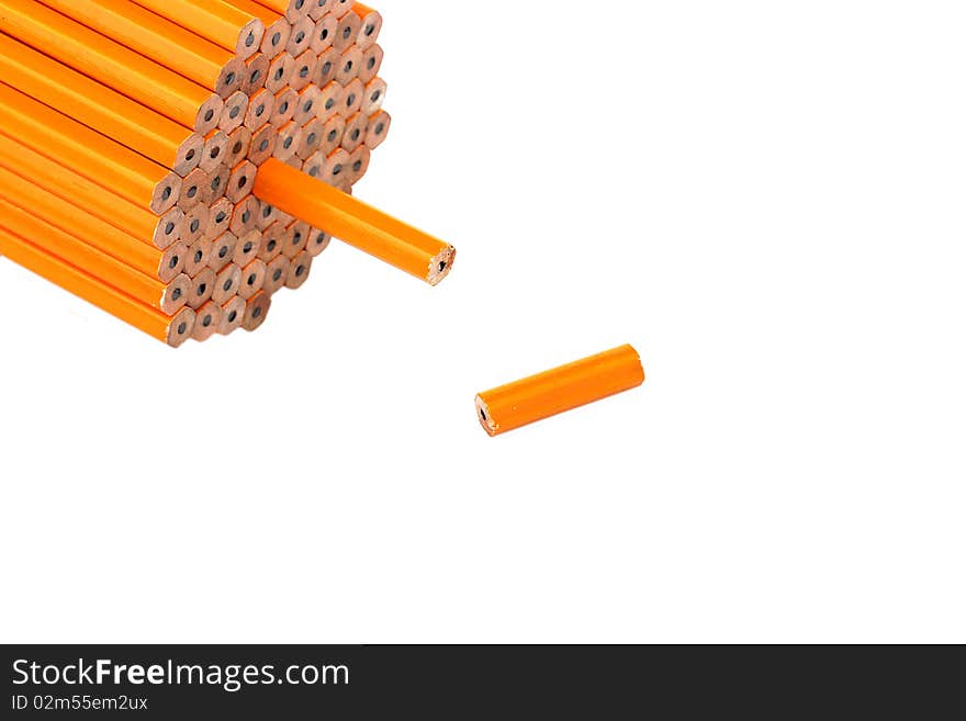 Pencil slice near to a pack on a white background. Pencil slice near to a pack on a white background.