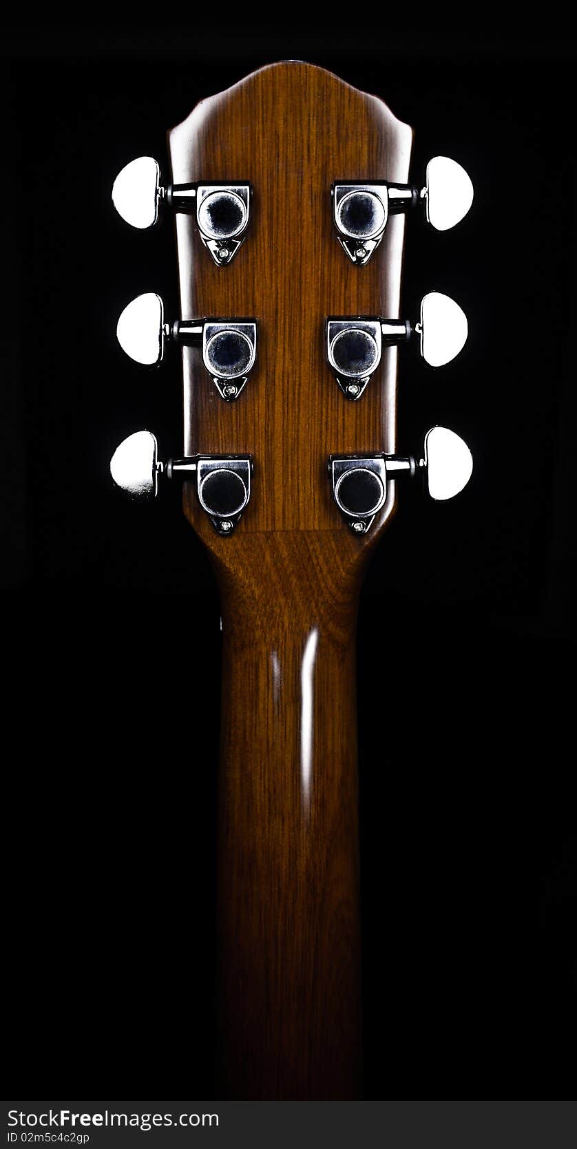 Guitar finger-board on a dark background. Guitar finger-board on a dark background