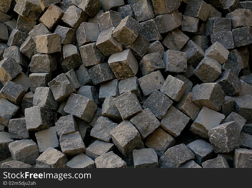 Cobblestone lie in a heap, ready to piling. Cobblestone lie in a heap, ready to piling